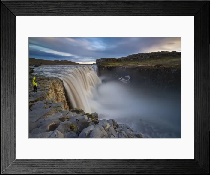 Framed Print : A man observes Dettifoss waterfall at its east side during midnight sun Framed Print : A man observes Dettifoss waterfall at its east side during midnight sun
