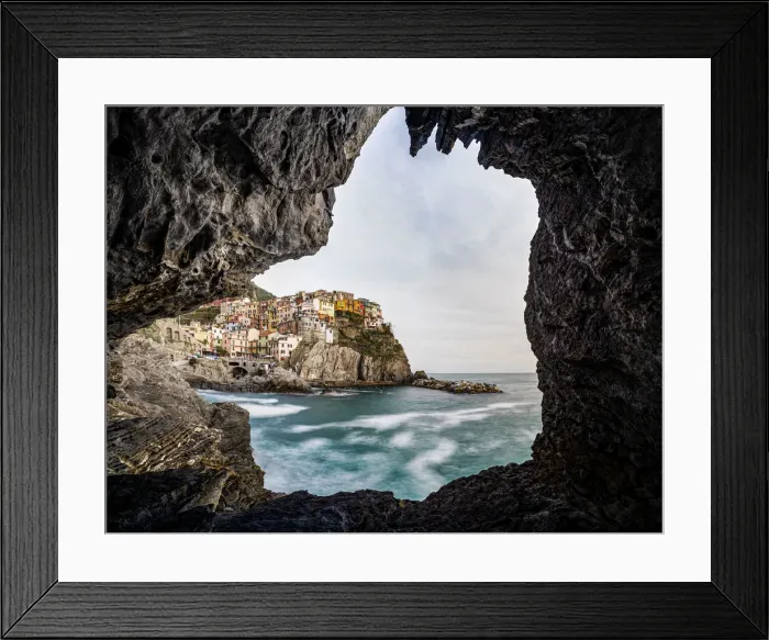 Framed Print : Italy, Liguria: Manarola from a cave on the shore Framed Print : Italy, Liguria: Manarola from a cave on the shore
