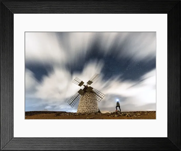 Framed Print : Hiker man with head torch admiring clouds in the starry sky over the windmill, La Oliva Framed Print : Hiker man with head torch admiring clouds in the starry sky over the windmill, La Oliva