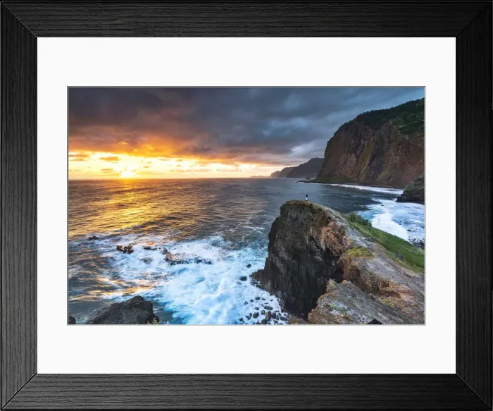 Framed Print : Man on cliffs looking at waves at dawn, Miradouro Do Guindaste viewpoint, Madeira island