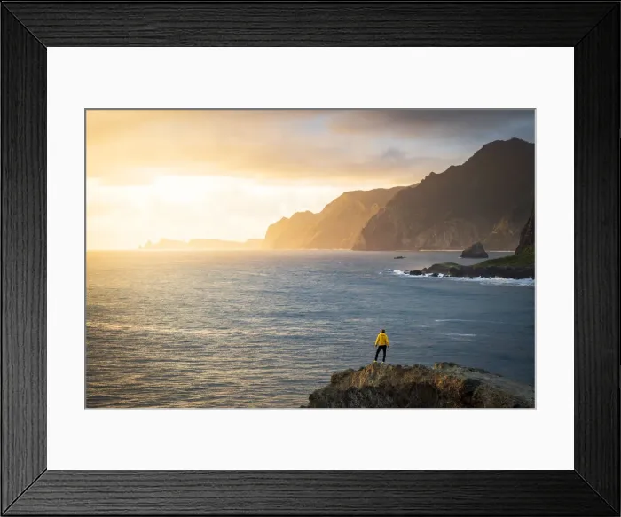 Framed Print : Man admiring the ocean from top of cliffs from Miradouro Do Guindaste viewpoint, Faial Framed Print : Man admiring the ocean from top of cliffs from Miradouro Do Guindaste viewpoint, Faial