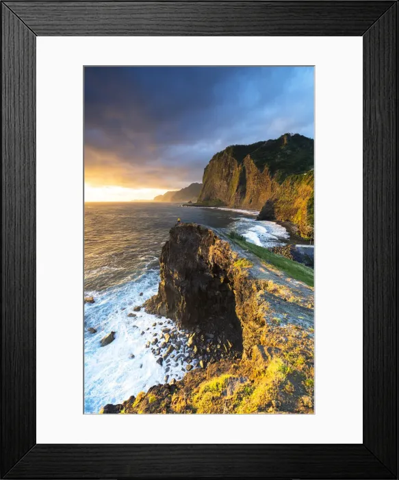 Framed Print : Hiker looking at the crashing waves at dawn from cliffs, Madeira, Portugal (MR) Framed Print : Hiker looking at the crashing waves at dawn from cliffs, Madeira, Portugal (MR)