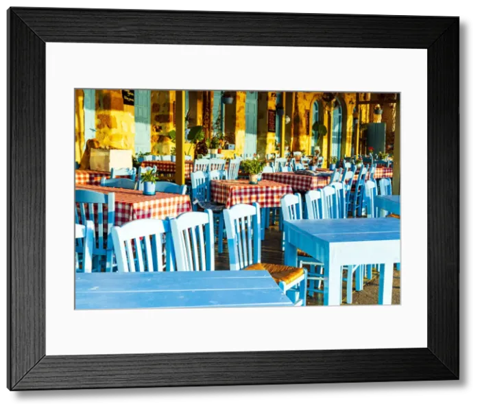 Framed Print : Traditional blue tables and chairs of a Greek restaurant (taverna), Chania, Crete, Greece Framed Print : Traditional blue tables and chairs of a Greek restaurant (taverna), Chania, Crete, Greece