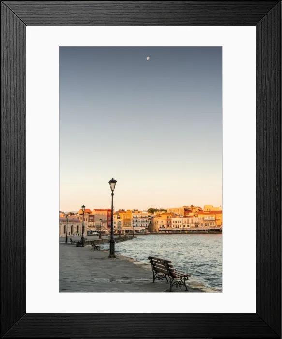 Framed Print : Bench on waterfront in the old Venetian harbour of Chania at dawn, Crete island, Greece