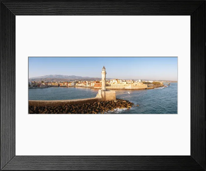 Framed Print : Majestic lighthouse overlooking the old harbour and colorful town of Chania, Crete Framed Print : Majestic lighthouse overlooking the old harbour and colorful town of Chania, Crete