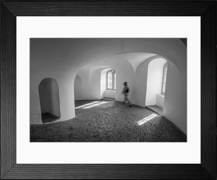 Framed Print : A tourist walks down the equestrian staircase (riders staircase)