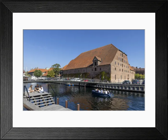 Framed Print : A boat passes a converted warehouse on a canal near the city centre, Copenhagen, Zealand Framed Print : A boat passes a converted warehouse on a canal near the city centre, Copenhagen, Zealand