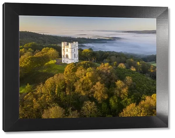 Haldon Belvedere (Lawrence Castle) illuminated by early sunlight on an autumnal morning