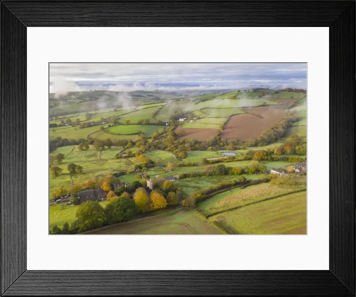 Framed Print : Rolling countryside around the hamlet of Cadbury in mid Devon, England Framed Print : Rolling countryside around the hamlet of Cadbury in mid Devon, England