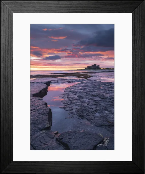 Framed Print : Beautiful sunrise above Bamburgh Castle, Northumberland, England. Autumn (October) 2021 Framed Print : Beautiful sunrise above Bamburgh Castle, Northumberland, England. Autumn (October) 2021