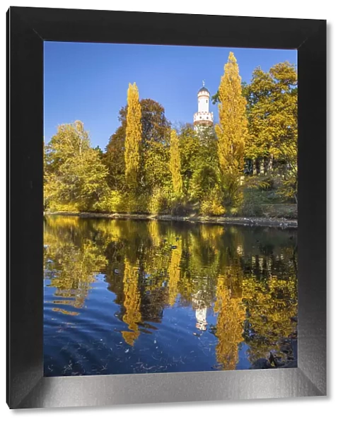 Pond in the castle park of Bad Homburg vor der Hoehe with white tower, Taunus, Hesse, Germany