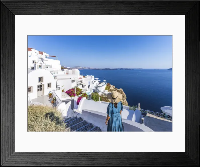 Framed Print : woman dressed in blue in Oia, Santorini, Greek Islands, Greece Framed Print : woman dressed in blue in Oia, Santorini, Greek Islands, Greece