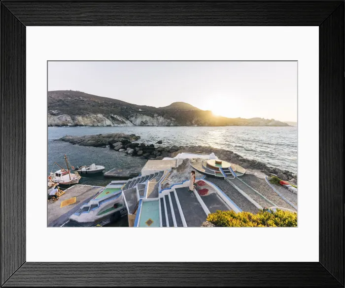 Framed Print : Woman at sunset at the colourful port of Mandraki on the island of Milos, Cyclades Framed Print : Woman at sunset at the colourful port of Mandraki on the island of Milos, Cyclades