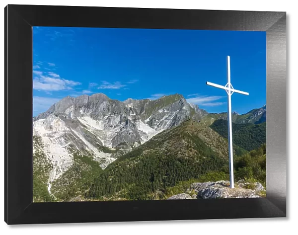 Europe, Italy, Tuscany. The marble quarries and the summit cross of Monte Tamburone above