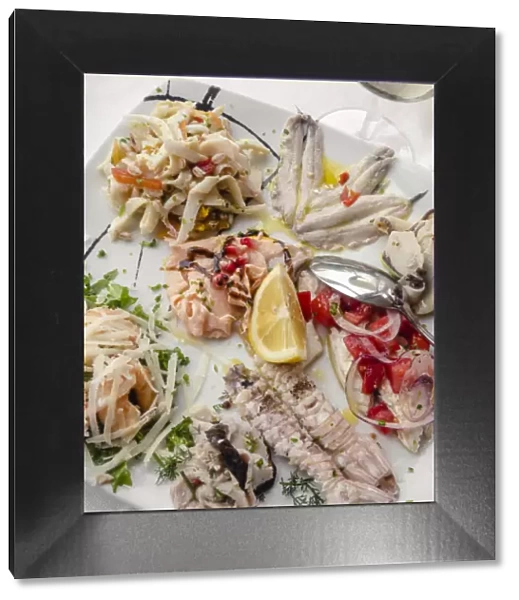 Europe, Italy, Marches. Mixed seafood platter for starter in a local restaurant