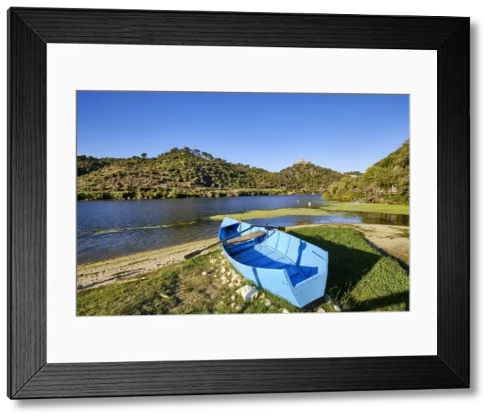 Framed Print : The Tagus river at Alamal beach. The 13th century castle of Belver dominates the entire