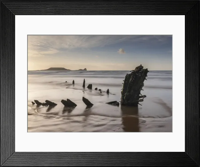 Framed Print : Remains of the shipwreck Helvetia on Rhossili Beach, with Worm