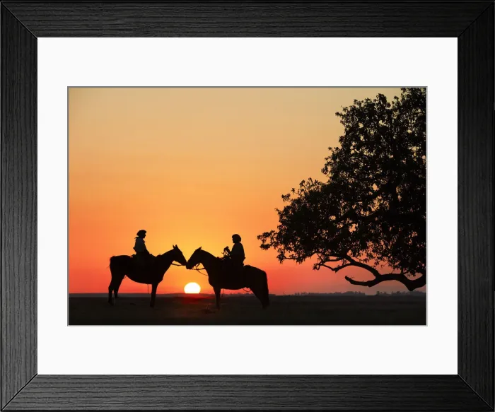 Framed Print : Gauchos on horseback at sunset near a giant rubber tree, Estancia Buena Vista, Esquina, Corrientes, Argentina Framed Print : Gauchos on horseback at sunset near a giant rubber tree, Estancia Buena Vista, Esquina, Corrientes, Argentina