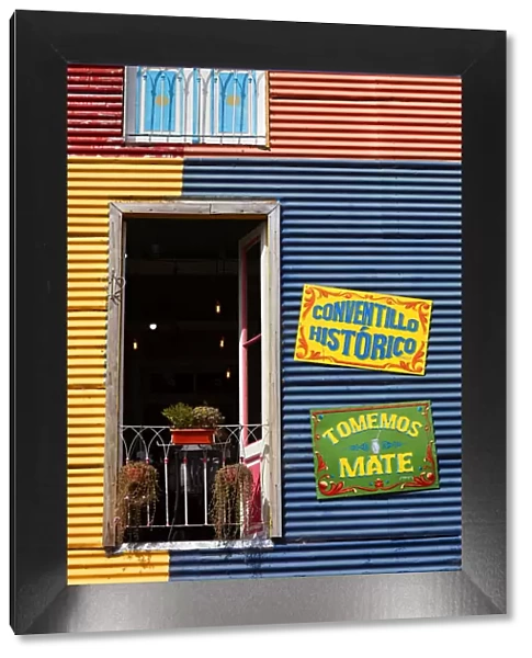The window of a colorful bar in the 'Caminito de La Boca'with wall decorations in 'Fileteado Art', Buenos Aires, Argentina