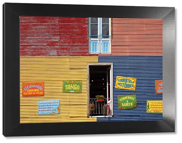 Windows of a colorful bar in the 'Caminito de La Boca'with wall decorations in 'Fileteado Art', Buenos Aires, Argentina