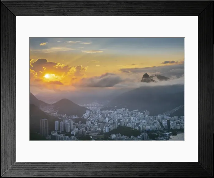 Framed Print : Brazil, Rio de Janeiro. Urban skyline and landscape with Christ statue, Botafogo neighborhood and mountains at sunset. Dramatic clouds, no people, copy space Framed Print : Brazil, Rio de Janeiro. Urban skyline and landscape with Christ statue, Botafogo neighborhood and mountains at sunset. Dramatic clouds, no people, copy space