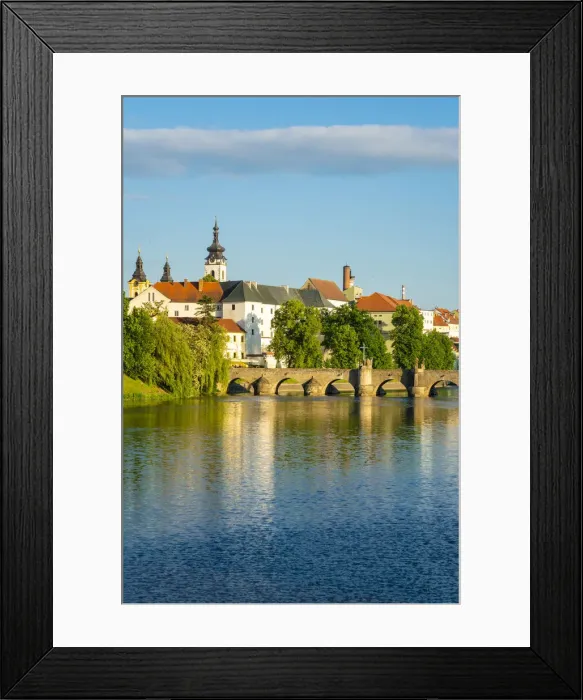 Framed Print : Pisek Stone bridge over Otava River with Pisek Castle in background, Pisek, South Bohemian Region, Czech Republic