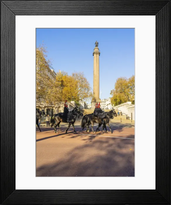 Framed Print : The Queens guards during the Changing of the Guard marching past the Duke of York Monument, London, England, UK Framed Print : The Queens guards during the Changing of the Guard marching past the Duke of York Monument, London, England, UK