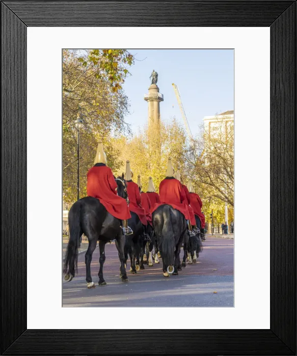 Framed Print : The Queens guards during the Changing of the Guard marching past the Duke of York Monument, London, England, UK Framed Print : The Queens guards during the Changing of the Guard marching past the Duke of York Monument, London, England, UK