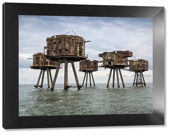 The towers of the Red Sands Fort - part of the decommissioned Maunsell Forts, the armed towers built in the Thames estuary to protect the Kent coast during the Second World War, near Whitstable, Kent, England