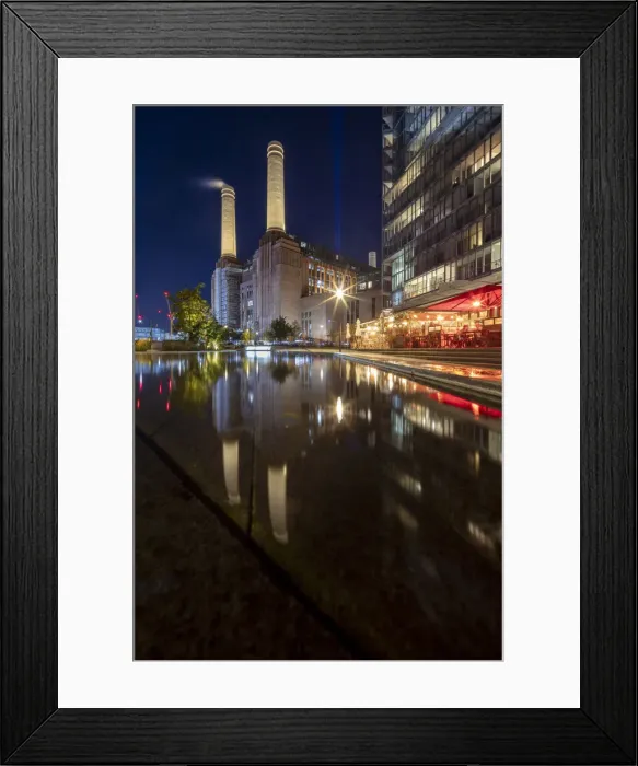 Framed Print : UK, England, London, Battersea, residential and shopping buildings at Battersea Power Station. Early Twentieth Century industrial architecture by Giles Gilbert Scott and Leonard Pearce. Modern buildings by Frank Gehry. Illuminated night view Framed Print : UK, England, London, Battersea, residential and shopping buildings at Battersea Power Station. Early Twentieth Century industrial architecture by Giles Gilbert Scott and Leonard Pearce. Modern buildings by Frank Gehry. Illuminated night view