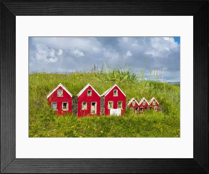 Framed Print : Red miniature Icelandic houses on green grass near Strandakirkja church, Selvogur, Reykjanes Peninsula, Iceland