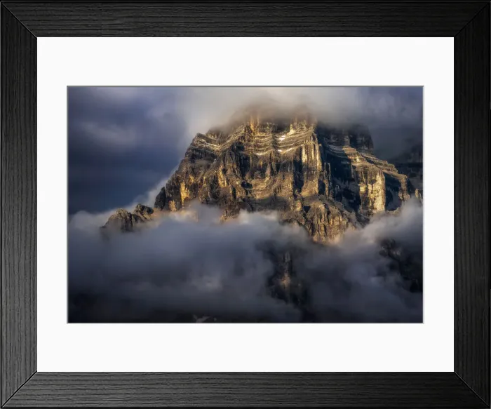 Framed Print : The walls of Mt. Pelmo in the Italian Dolomites hit by the golden light during a clearing storm in summer Framed Print : The walls of Mt. Pelmo in the Italian Dolomites hit by the golden light during a clearing storm in summer