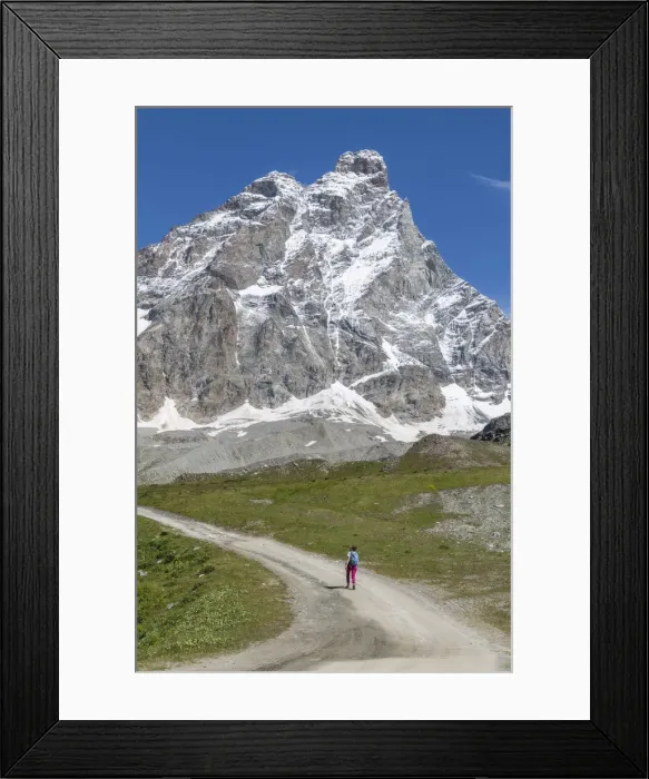 Framed Print : A lonely person hiking under the Matterhorn (Cervino) during a sunny summer day in the Italian Alps Framed Print : A lonely person hiking under the Matterhorn (Cervino) during a sunny summer day in the Italian Alps