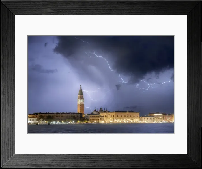 Framed Print : A stormy late summer night in Venice: pictured in the frame is St. Mark Square, with its tower and its palace, from the Giudecca island. Venice, Italy Framed Print : A stormy late summer night in Venice: pictured in the frame is St. Mark Square, with its tower and its palace, from the Giudecca island. Venice, Italy