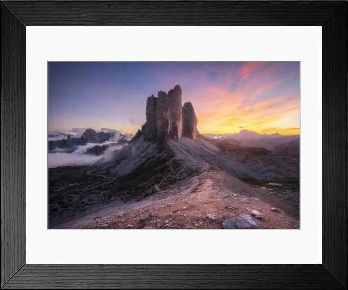 Framed Print : The Tre Cime di Lavaredo lined up from the Forcella Lavaredo during a cold late summer sunset, with the Cadini di Misurina emerging from the fog on the left. Dolomites, Italy Framed Print : The Tre Cime di Lavaredo lined up from the Forcella Lavaredo during a cold late summer sunset, with the Cadini di Misurina emerging from the fog on the left. Dolomites, Italy