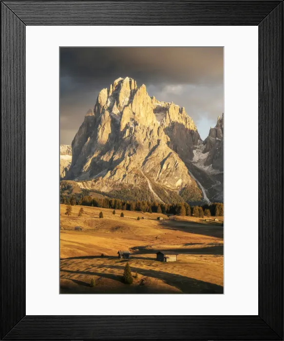 Framed Print : Two old cabins lost in the meadows of the Alpe di Siusi (Seiser Alm) during an early autumn sunset, with the Sassolungo and Sassopiatto in the background. Dolomites, Italy Framed Print : Two old cabins lost in the meadows of the Alpe di Siusi (Seiser Alm) during an early autumn sunset, with the Sassolungo and Sassopiatto in the background. Dolomites, Italy