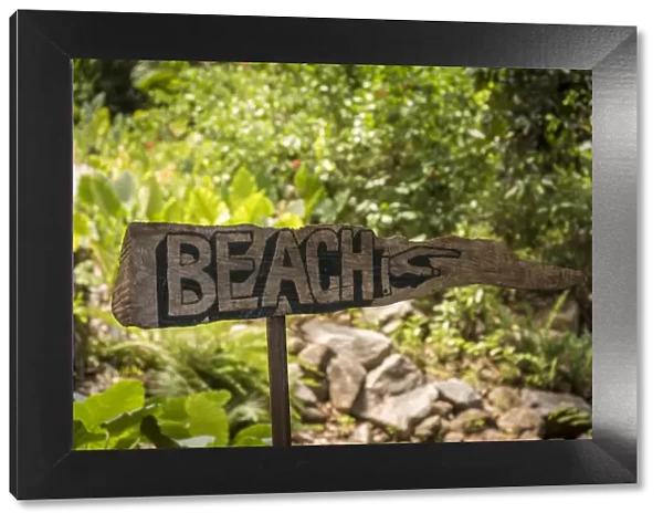 africa, Seychelles, Mahe. Wooden sign to the beach at Petite Anse, of the Four Seasons Hotel