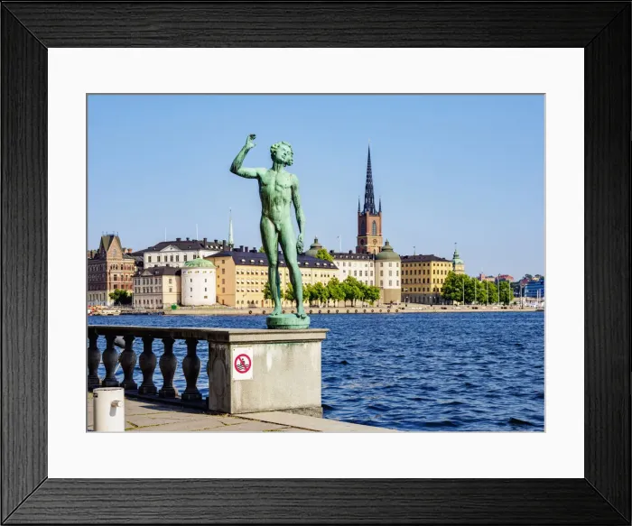 Framed Print : Statue in the City Hall Garden with Riddarholmen Islet in the background, Stockholm, Stockholm County, Sweden