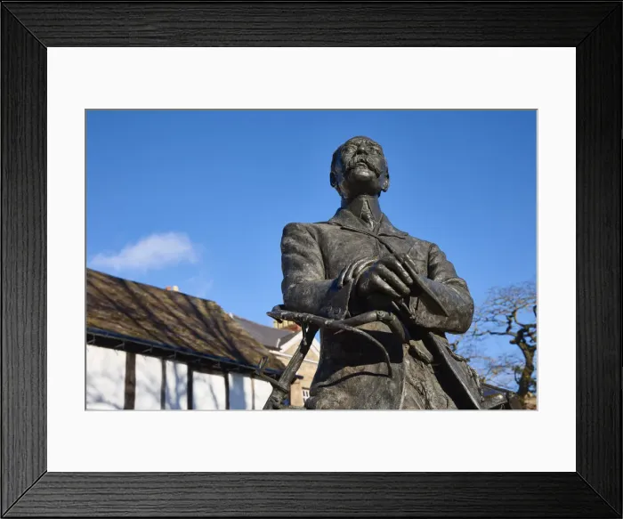 Framed Print : UK, England, Herefordshire, Hereford, Edward Elgar Statue leaning against a bicycle infront of Cathedral barn