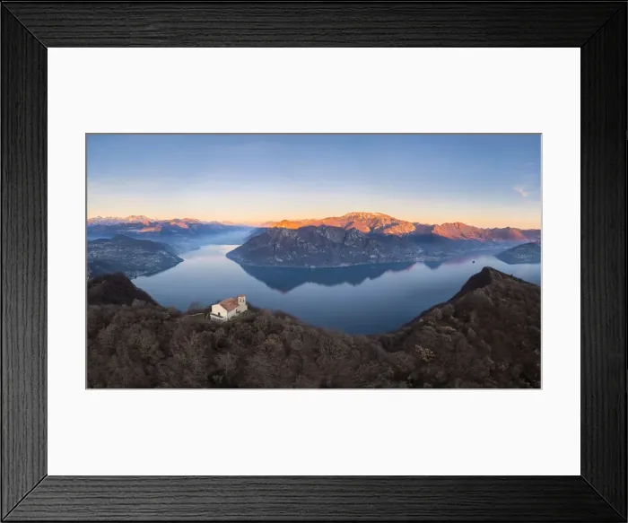 Framed Print : small church of Santuario della Santissima Trinit at the top of a mountain dominating Lake Iseo at sunset. Parzanica, Iseo Lake, Bergamo district, Lombardy, Italy Framed Print : small church of Santuario della Santissima Trinit at the top of a mountain dominating Lake Iseo at sunset. Parzanica, Iseo Lake, Bergamo district, Lombardy, Italy