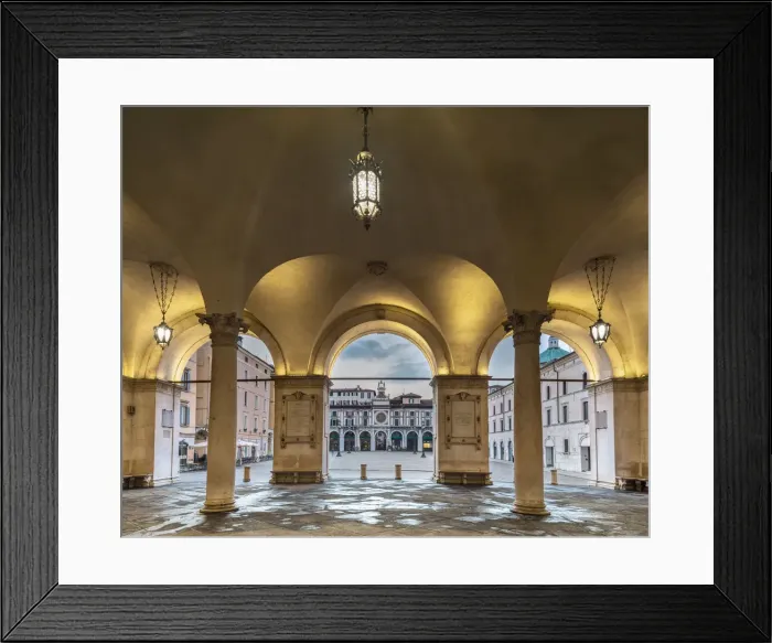 Framed Print : arcades with columns of the Palazzo della Loggia illuminated in the first morning, with the square in the background, Brescia, Lombardy, Italy Framed Print : arcades with columns of the Palazzo della Loggia illuminated in the first morning, with the square in the background, Brescia, Lombardy, Italy