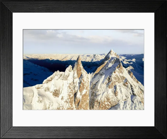Framed Print : Rock pinnacles of Ago Di Sciora and Pioda Di Sciora peaks at sunrise, aerial view, Val Bregaglia, Graubunden, Switzerland Framed Print : Rock pinnacles of Ago Di Sciora and Pioda Di Sciora peaks at sunrise, aerial view, Val Bregaglia, Graubunden, Switzerland