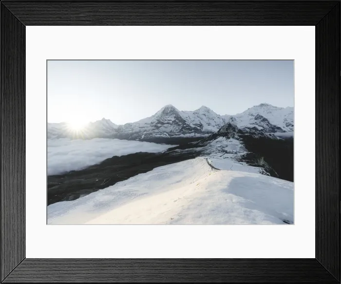 Framed Print : Foggy sky at dawn on the snowcapped Eiger, Monch and Jungfrau peaks, Mannlichen, Jungfrau Region, Berner Oberland, Switzerland