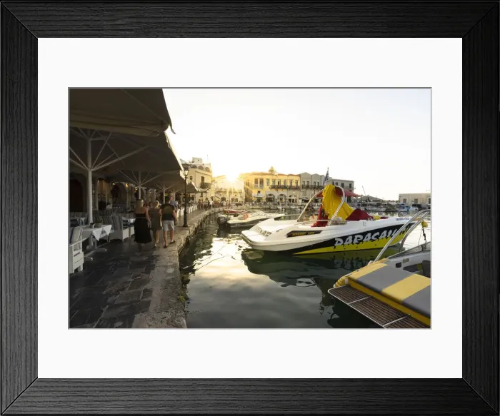 Framed Print : Tourists walking on waterfront at sunset in the old Venetian harbour of Rethymno, Crete island, Greece Framed Print : Tourists walking on waterfront at sunset in the old Venetian harbour of Rethymno, Crete island, Greece