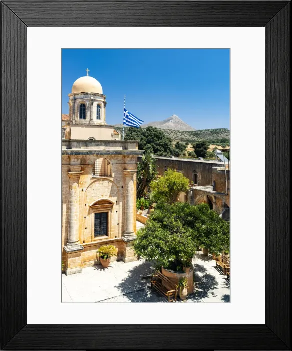 Framed Print : Clear sky over the dome and Greek flag hanging on ancient Agia Triada of Tzagarolon monastery, Crete island, Greece