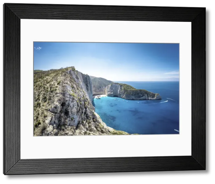 Framed Print : Majestic limestone cliffs surrounding the idyllic Navagio Beach (Shipwreck Beach), aerial view, Zakynthos island, Greece Framed Print : Majestic limestone cliffs surrounding the idyllic Navagio Beach (Shipwreck Beach), aerial view, Zakynthos island, Greece