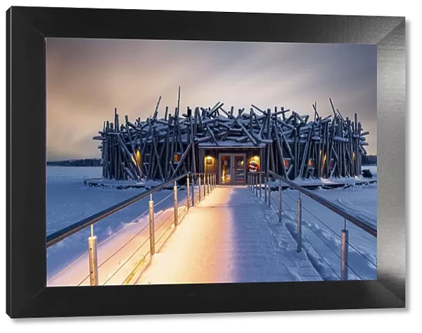 Arctic Bath Hotel and snowy walkway on frozen river Lule, Harads, Lapland, Sweden