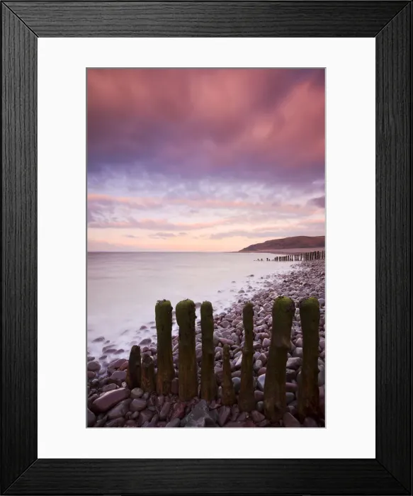 Framed Print : Weathered wooden groynes on Porlock Beach under a pink sunset sky, Exmoor National Park, Somerset, England. Winter (February) 2010 Framed Print : Weathered wooden groynes on Porlock Beach under a pink sunset sky, Exmoor National Park, Somerset, England. Winter (February) 2010