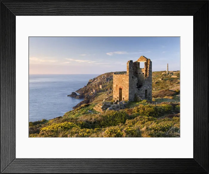 Framed Print : Abandoned tin mine engine houses and chimney stacks lie scattered over the clifftops at Botallack, St Just, Cornwall, England. Spring (April) 2010