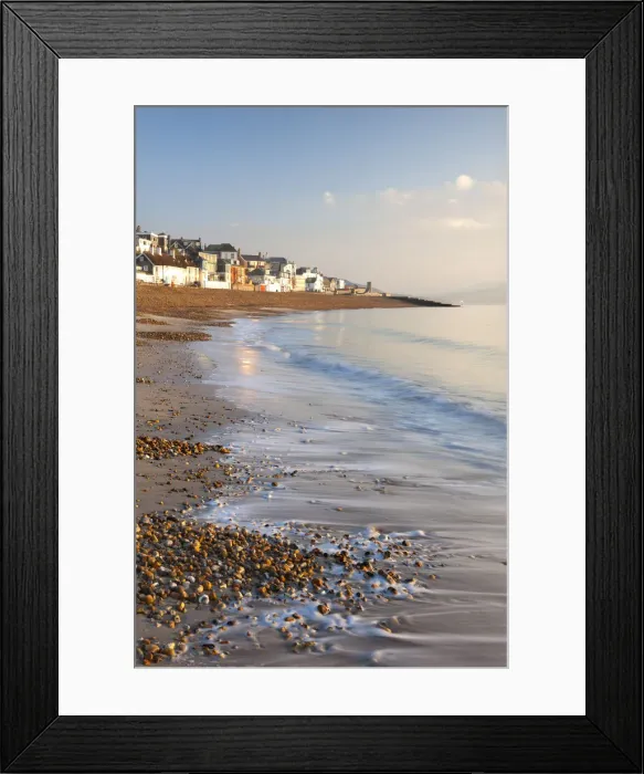 Framed Print : Waves lap onto the shores of Lyme Regis beach on the Jurassic Coast, Lyme Regis, Dorset, England. Winter (December) 2010 Framed Print : Waves lap onto the shores of Lyme Regis beach on the Jurassic Coast, Lyme Regis, Dorset, England. Winter (December) 2010